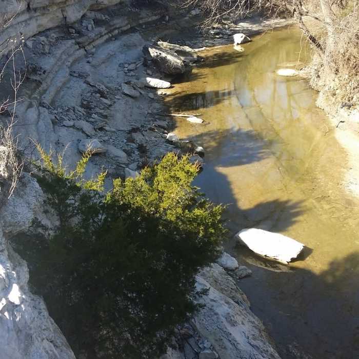 Right near the parking area, this limestone cliff overlook offers an interesting look at the rock and river below. Near Spring Creek Forest Preserve
