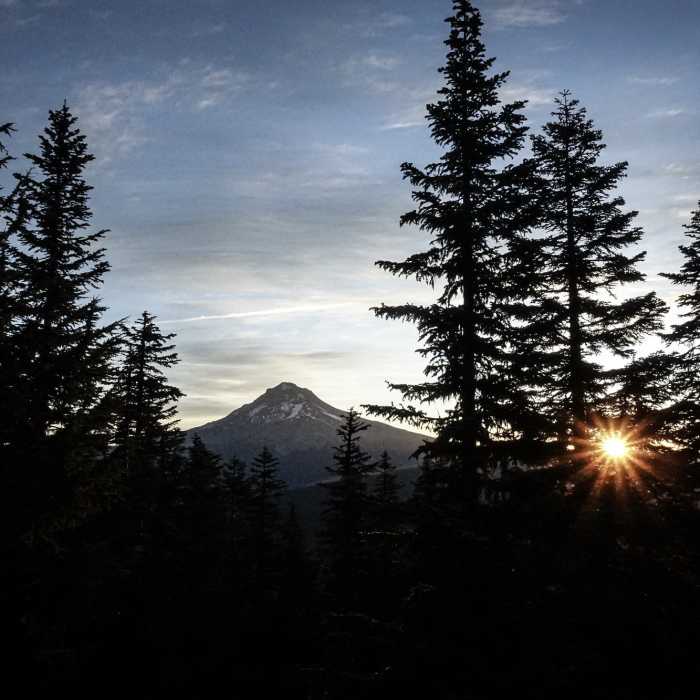 Sun rising near Mt. Hood from Devils Peak Lookout. Near Hunchback Trail #793