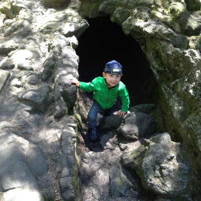 Cole (3.5yrs) exiting the cave. Near Trail of Two Forests