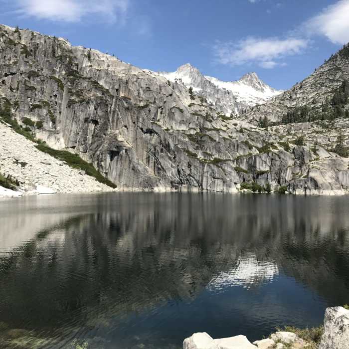 Dramatic granite headwall on Upper Canyon Creek Lake in Trinity Alps Wilderness Near Little Lake Trail