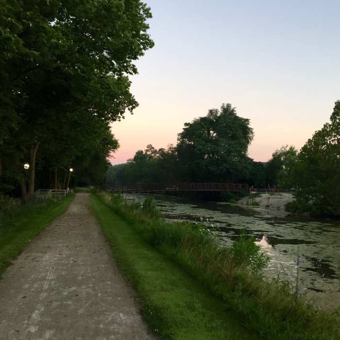 Section of trail in Morris. Notice the footbridge connecting to the neighborhood on the other side of the canal. Near I & M Canal Trail