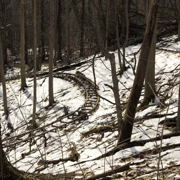 Abandoned alpine slide in the woods. Near Lookout Trail