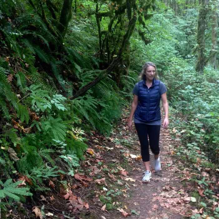 A hiker out for some evening exercise checks out the early fall colors along Rocking Chair Creek on the Nature Trail. Bill Cunningham Photo Near NW Leif Erikson Drive Trail