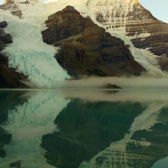 Mt. Robson reflecting into Berg Lake on a clear, still morning Near Berg Lake Trail