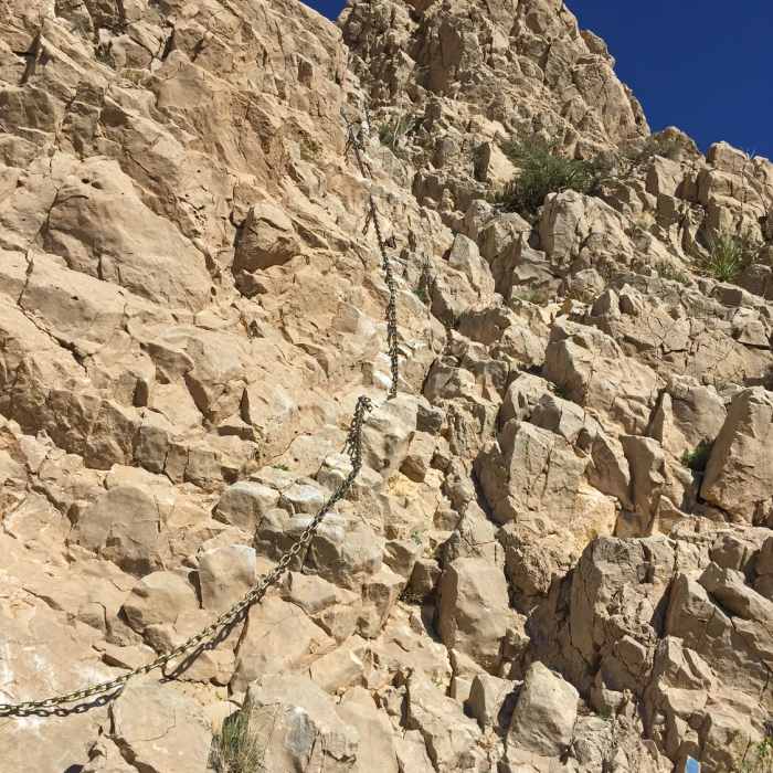 About as tough as it gets along a trail, the climbing segments on Ron Coleman are fairly easy by bouldering standards, maybe a v1. There are plenty of good holds and a chain to help out. Near Ron Coleman Trail