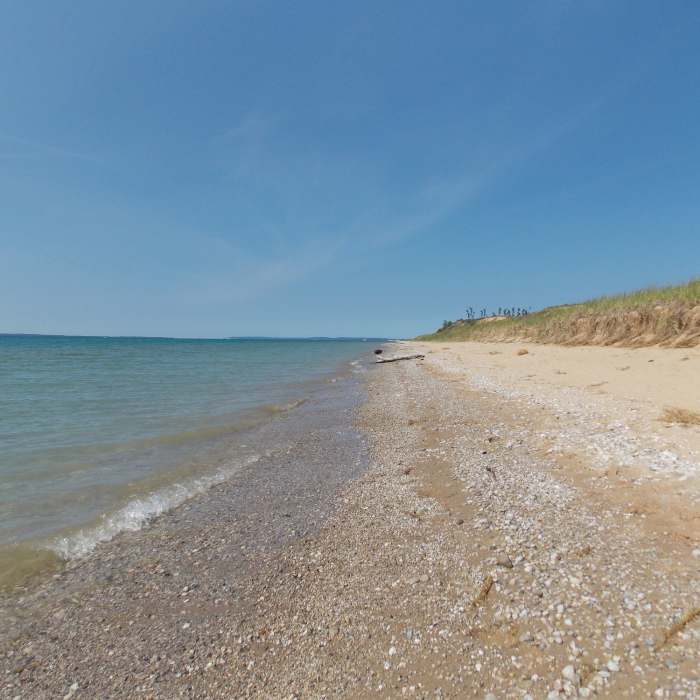 The beach at the end of the trail is sandy and seemingly endless. Very easy to get your own private section. Near Dunes Trail