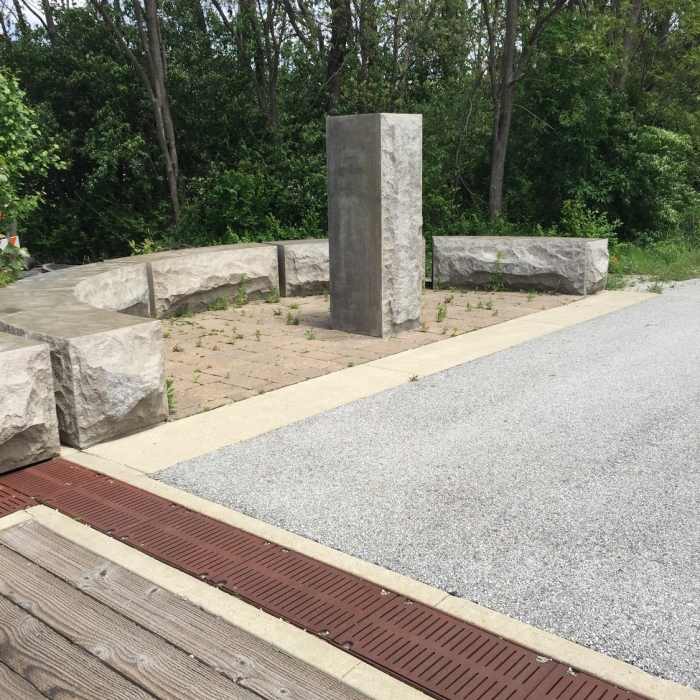 Stone benches create a place to rest your feet and enjoy some sunshine. Near B&O Trail (East)