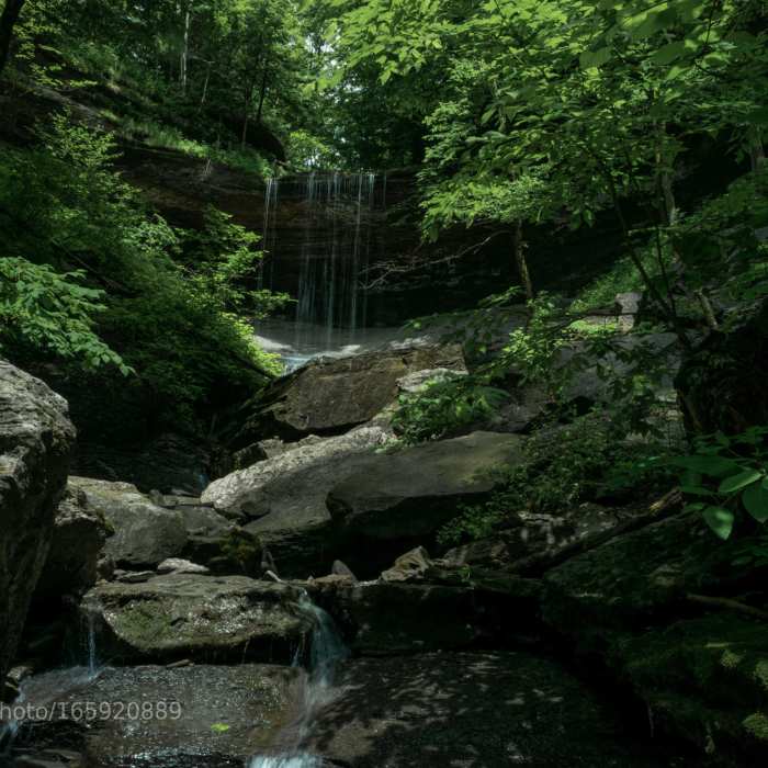 After a light summer rain, water dribbles over Tinker Falls in Truxton, NY. Near Tinker Falls Upper Loop