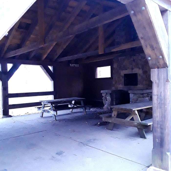Pausing at a classic hut Near Escoheag Trail Loop