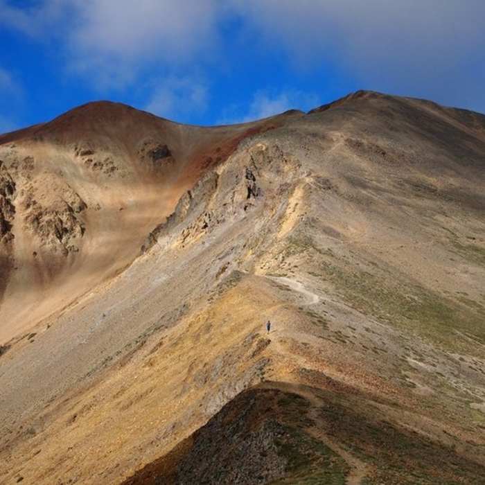 Redcloud Peak seen from the saddle. The summit is on the left, with the false summit to the right. Near Redcloud Peak