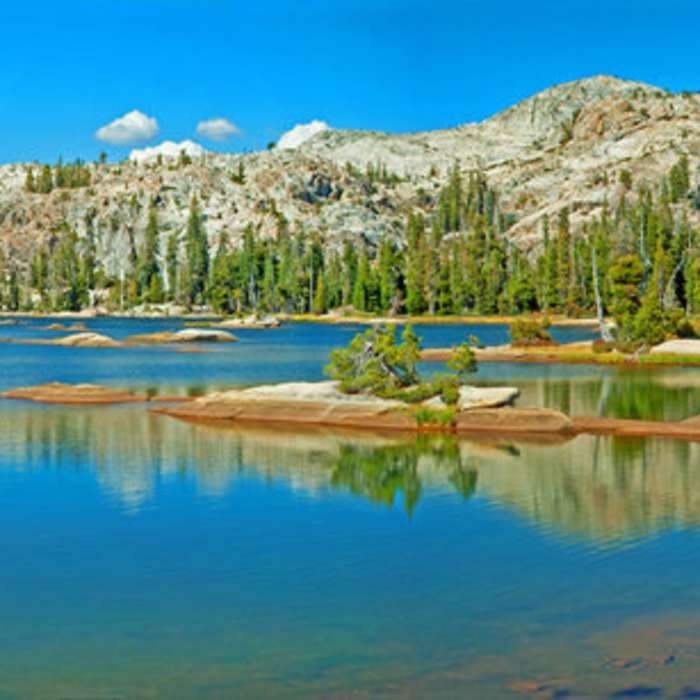 Shallow, but a beautiful place to swim. Camp on south or northwest shores. The east side is tree-covered and swampy. Near Flora Lake - Boundary Lake Route