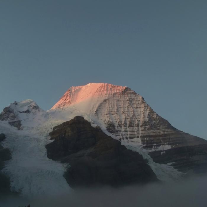 Early morning alpenglow on Mt. Robson, on a rare, perfectly clear morning. Near Berg Lake Trail