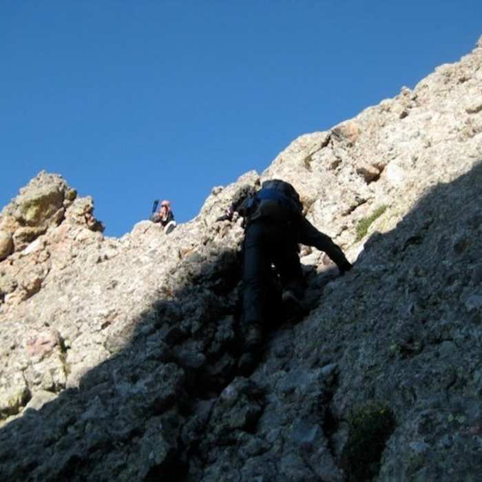 This 15-20 ft wall separating the east and west gullies is the crux of the climb. Fortunately the rock is solid and the climb is short, with excellent handholds on famed Crestone conglomerate. Near Crestone Peak South Face