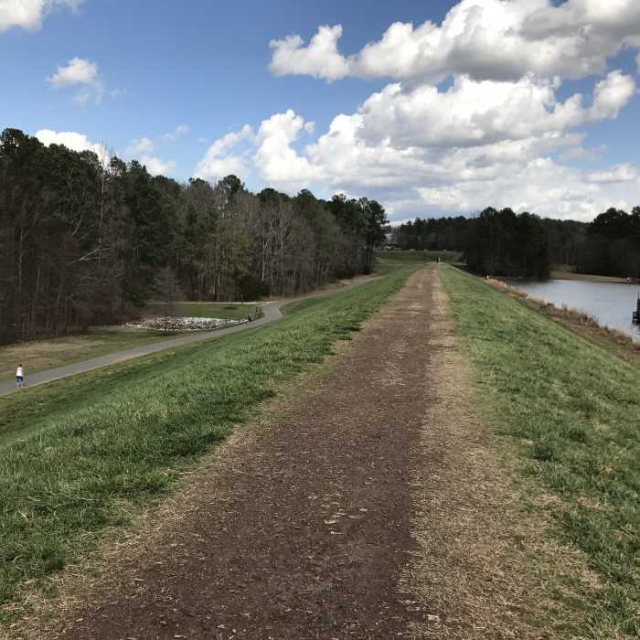 At this point, the Lake Trail traverses the top of the dam. Near Bond Park Lake Loop