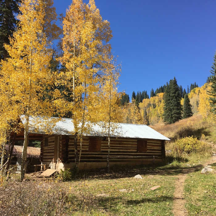 This old log cabin is the property of the San Juan National Forest. Look for the trail junction just beyond the cabin. Near Castle Rock Trail