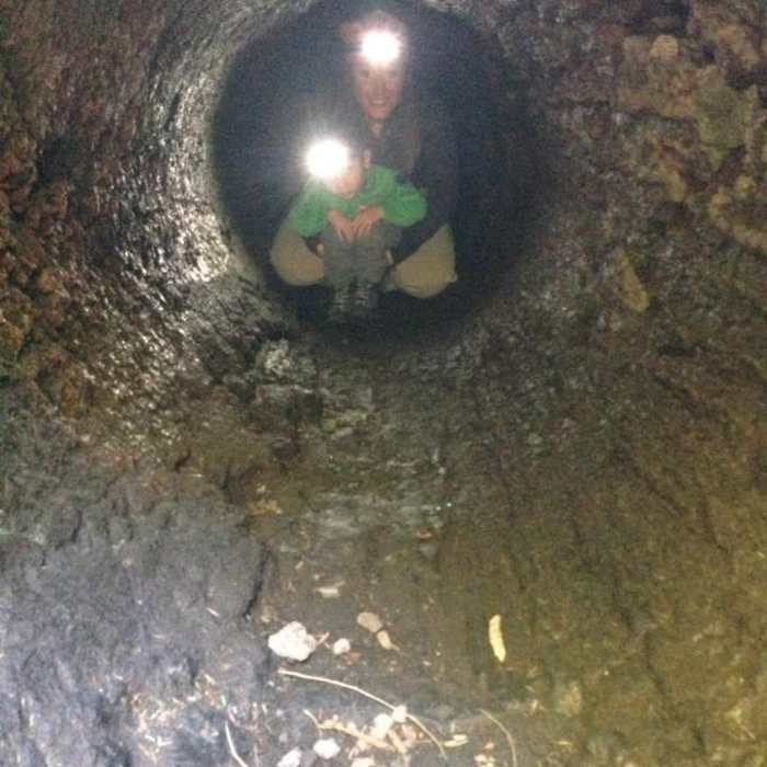 Me and Cole (3.5yrs) inside the cave. Grownups and big kids need to crawl on knees to get through. Near Trail of Two Forests